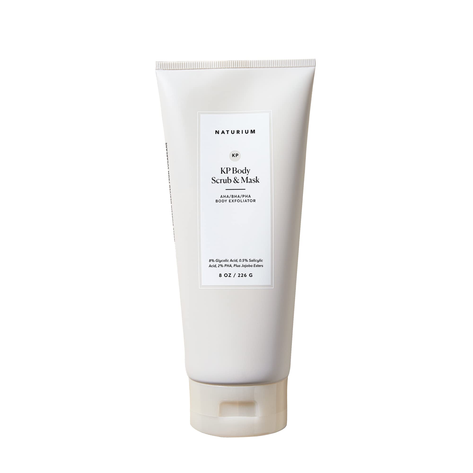 Naturium KP body scrub jar close-up shows exfoliating texture for smoother skin.
