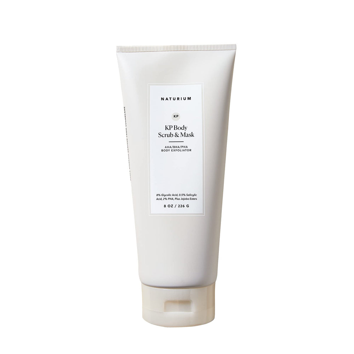 Naturium KP body scrub jar close-up shows exfoliating texture for smoother skin.