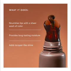 Naturium Phyto-Glow Lip Balm tube close-up showing creamy texture and glossy finish.