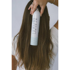 NAVY HAIR CARE Skipper volumizing spray delivering full-bodied look.