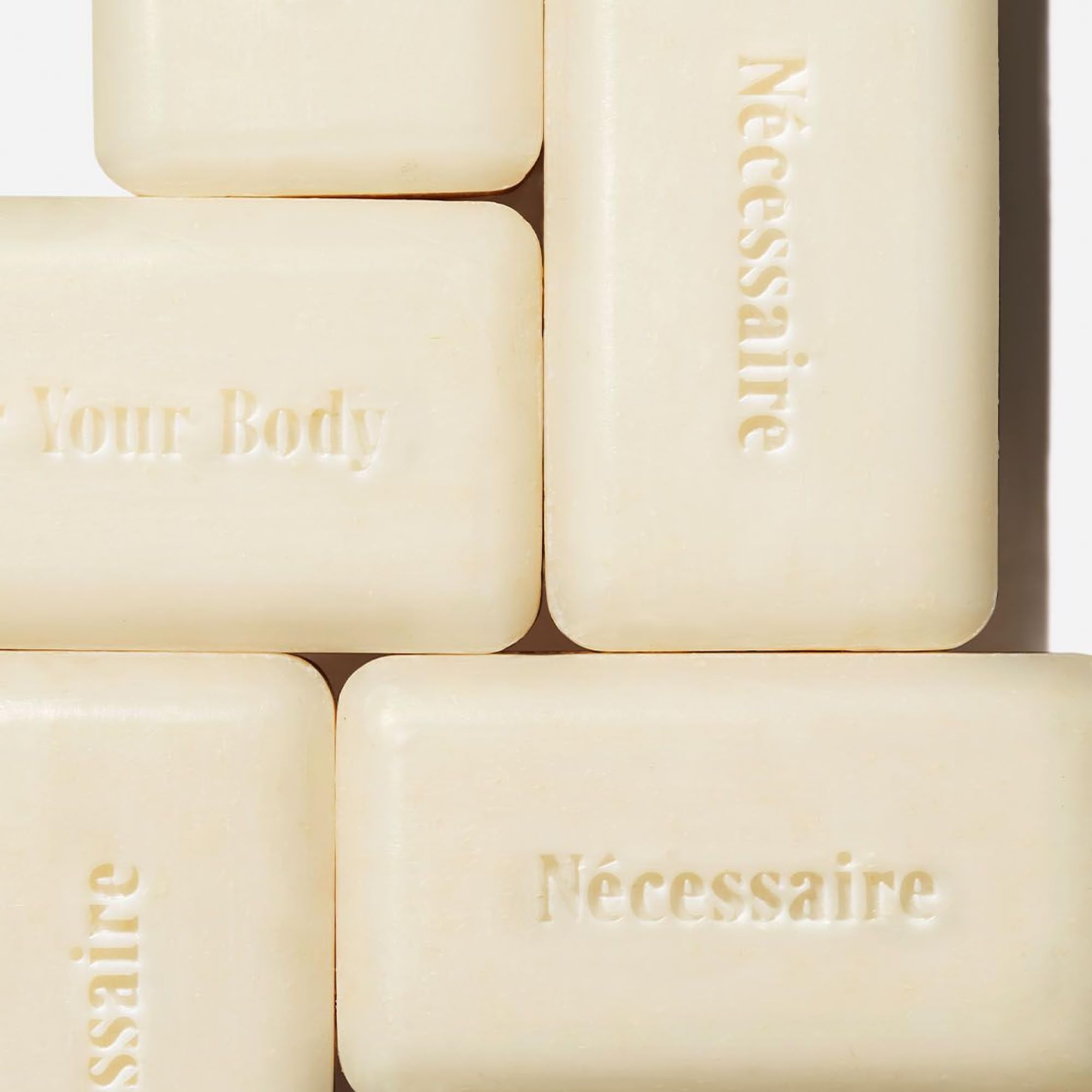 Nécessaire barra exfoliante cuerpo niacinamida mejora textura y tono.
