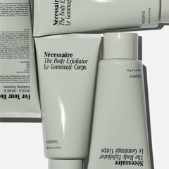 Nécessaire Body Exfoliator volcanic pumice close-up showing physical exfoliation