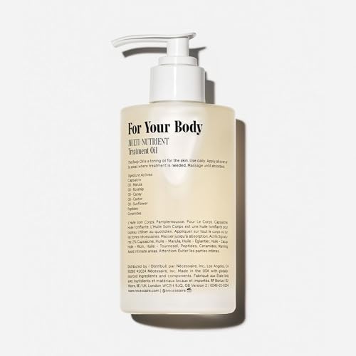 Nécessaire body oil label closeup highlighting niacinamide and vitamins