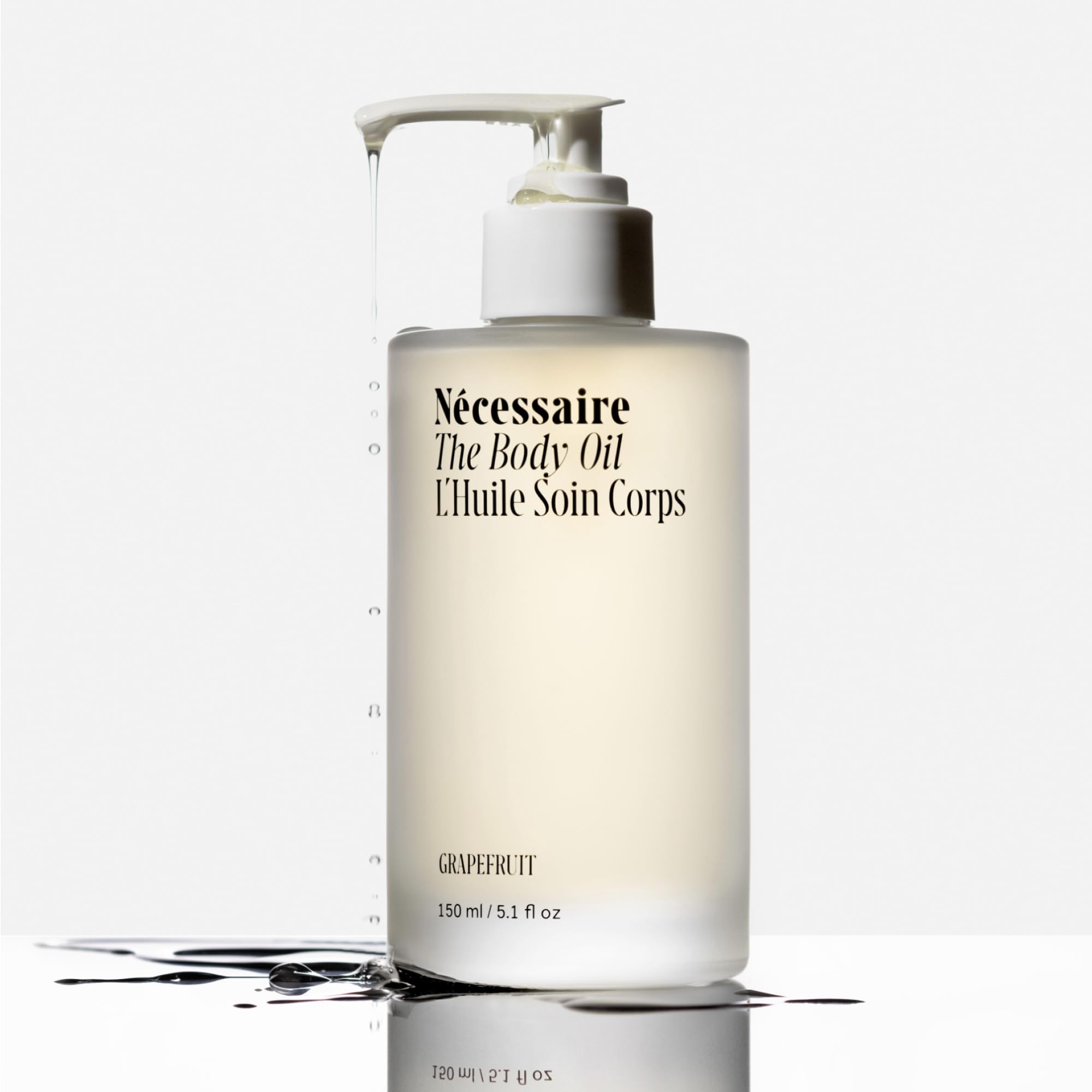 Nécessaire body oil texture on hand showing quick-absorbing hydration