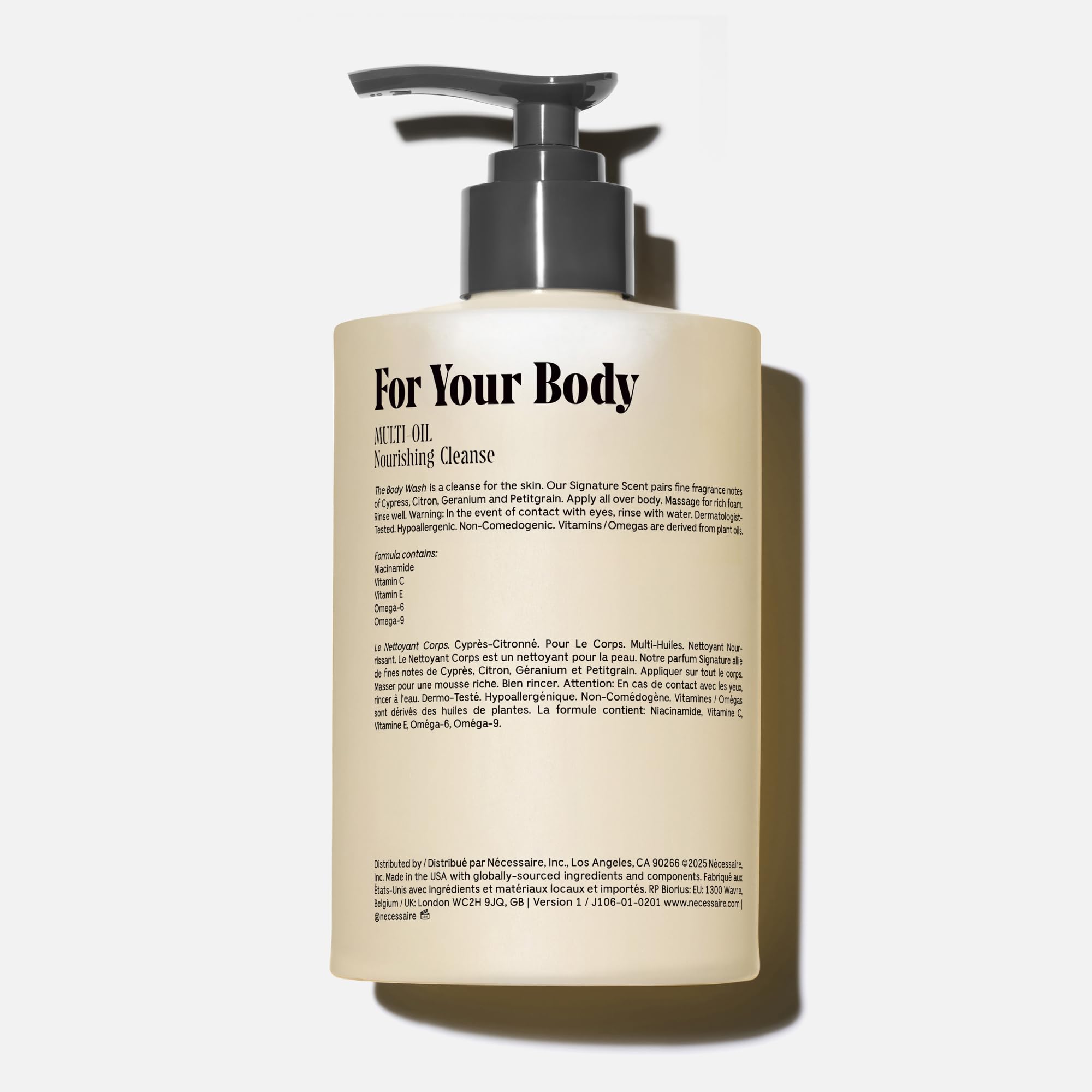 Rich foaming Nécessaire body wash on a clean shower scene.
