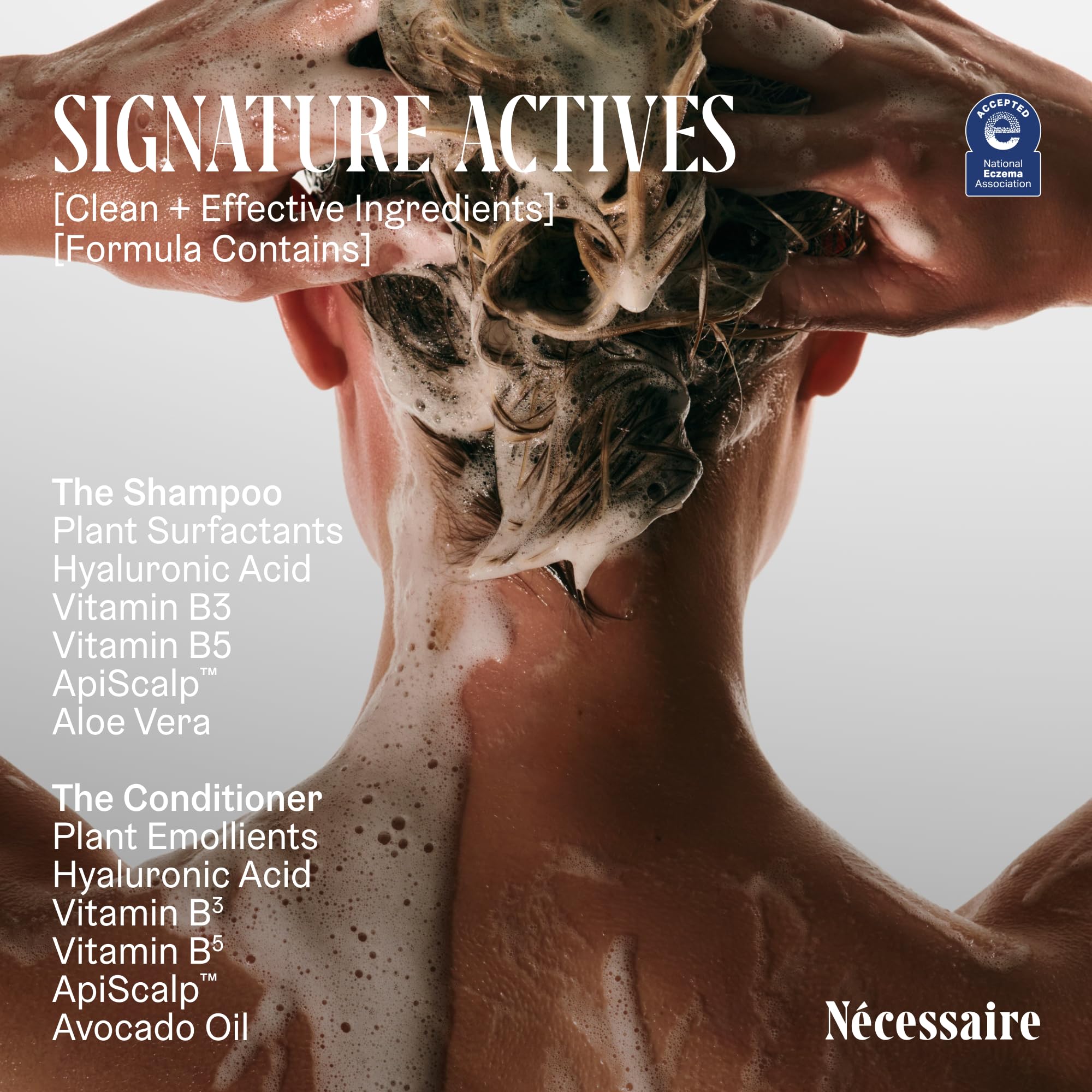 Nécessaire The Hair Duo bottle on shelf in a clean bathroom setup