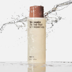 Necessaire Olibanum body wash foam close-up shows rich lather and delicate fragrance