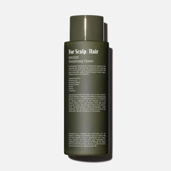Nécessaire Rosemary Shampoo back label close-up noting dermatologist-tested formula.