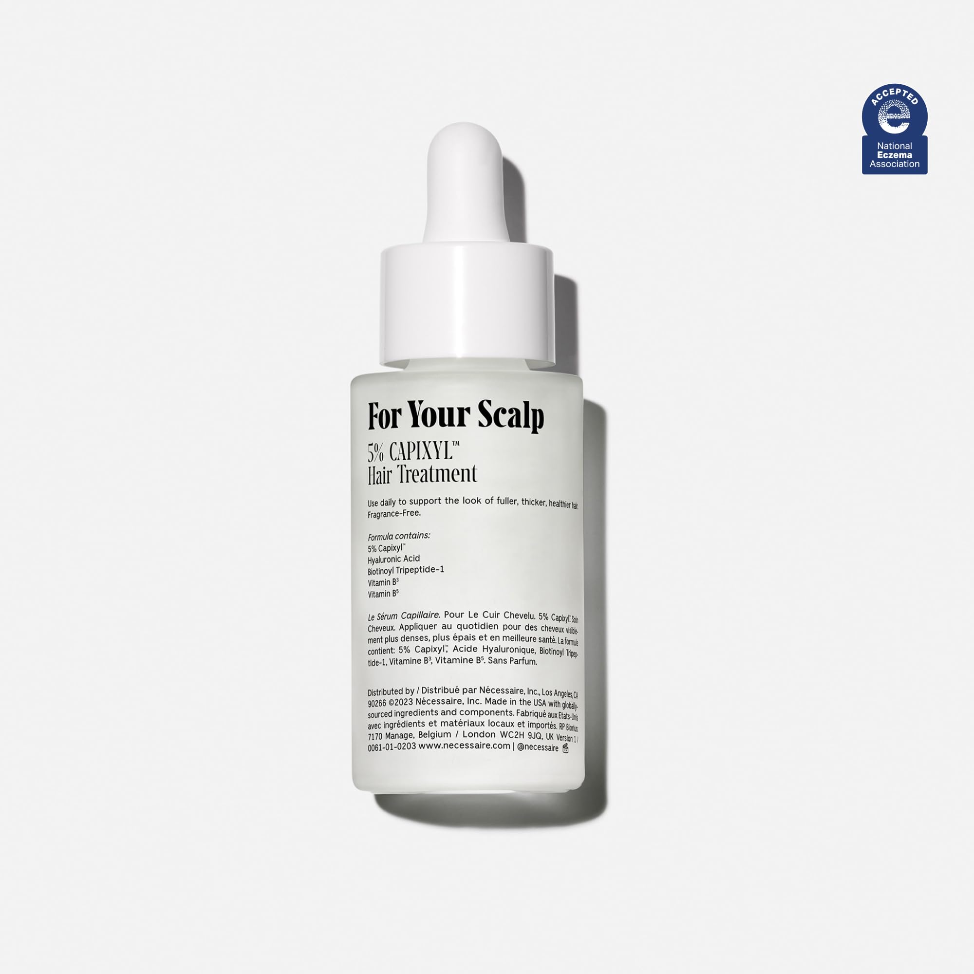 Nécessaire Scalp Serum pipette dispensing demonstrates easy daily application.