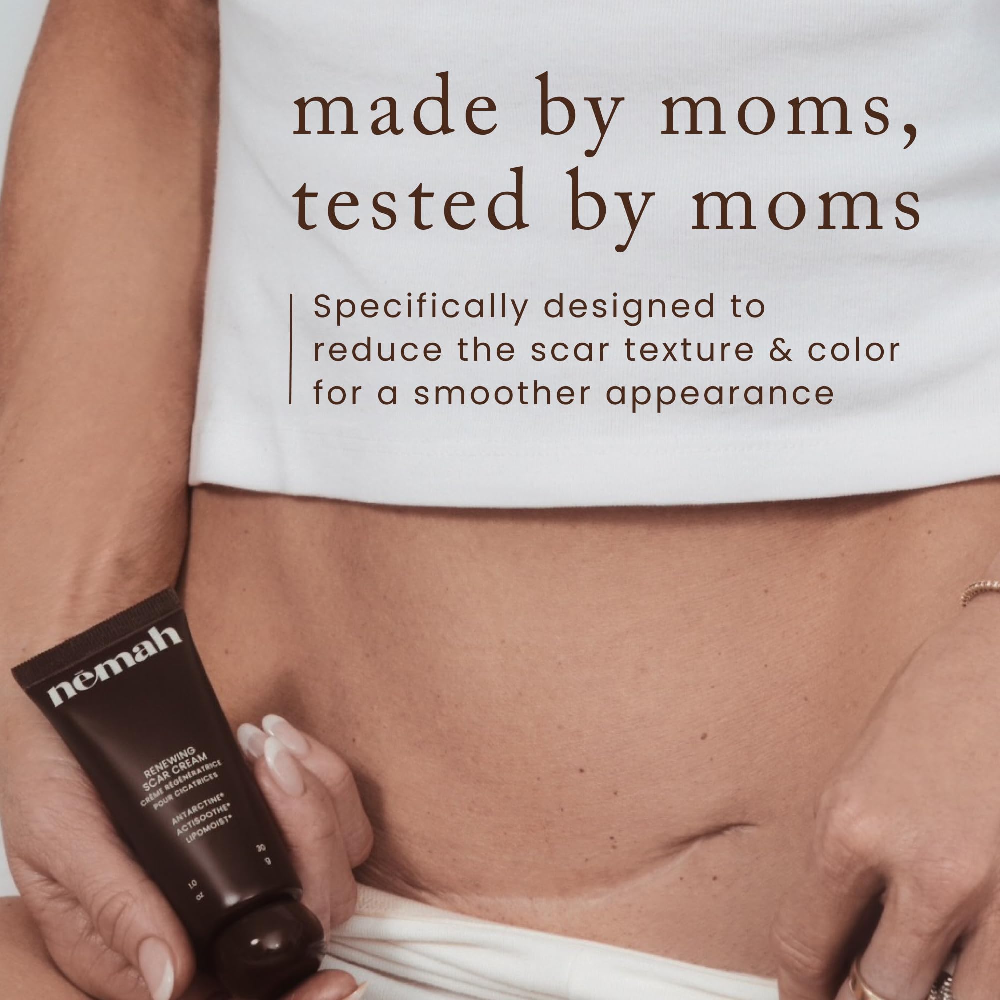 Person applying Nemah Restorative Scar Treatment to a postpartum scar area