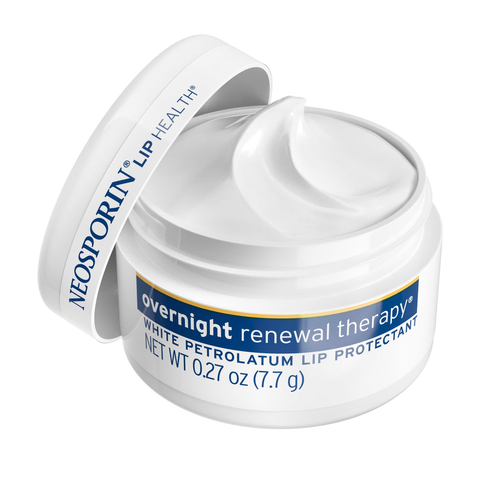 Neosporin Lip Health jar in hand ready for nightly use