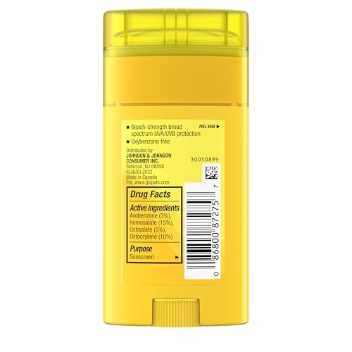 Neutrogena Beach Defense Sunscreen Stick SPF 50 in a cosmetic bag for travel-ready sun care