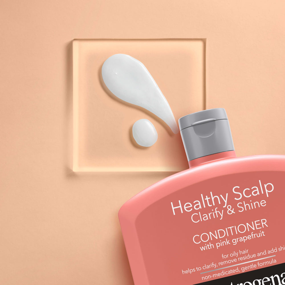 Neutrogena Exfoliating Healthy Scalp Clarify & Shine: pomelo rosa iluminado en iluminación natural