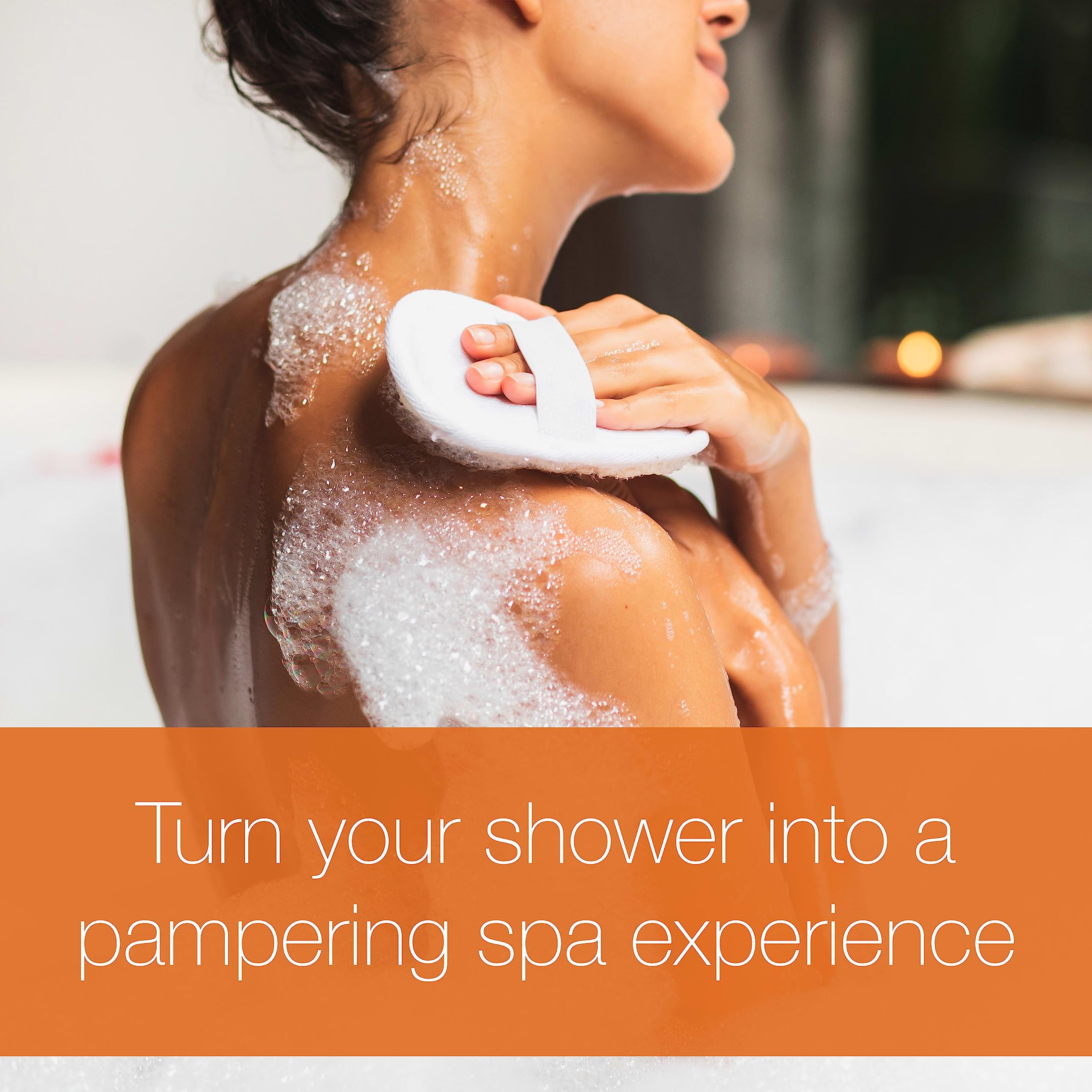 Shower scene showing hands lathering Neutrogena Rainbath for full-body cleanse.