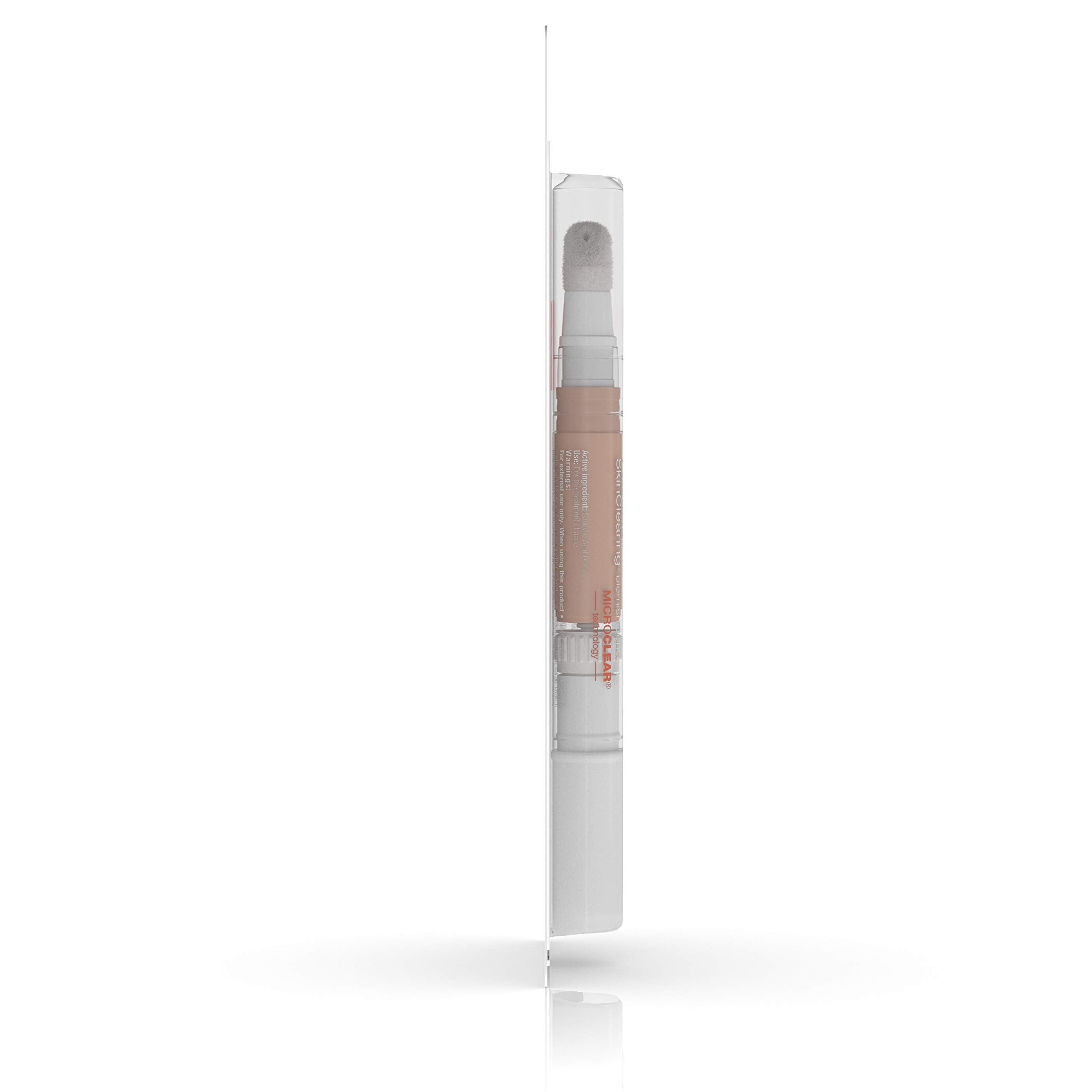 Neutrogena SkinClearing Blemish Concealer applying with brush for precise coverage.