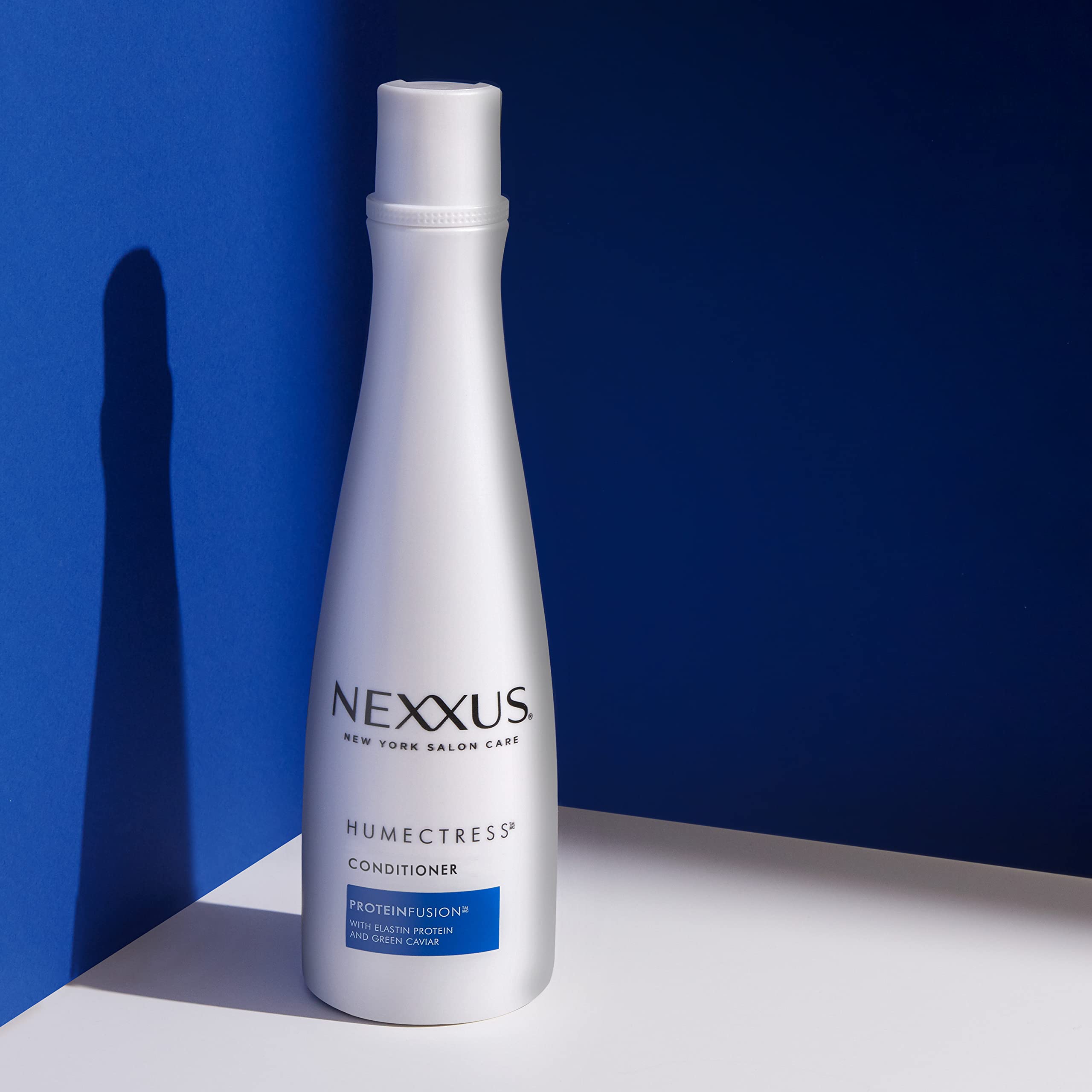 Nexxus shampoo application close-up demonstrating hydrating cleansing