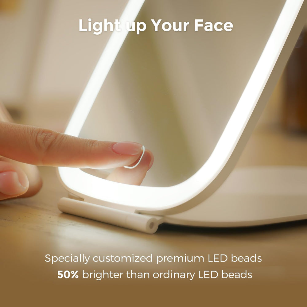 NEZZOE foldable travel mirror, compact and sturdy for desk use.