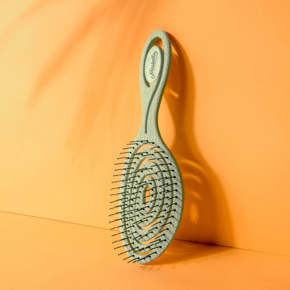 Ninabella detangle brush suitable for all hair types including curly, straight, and wavy
