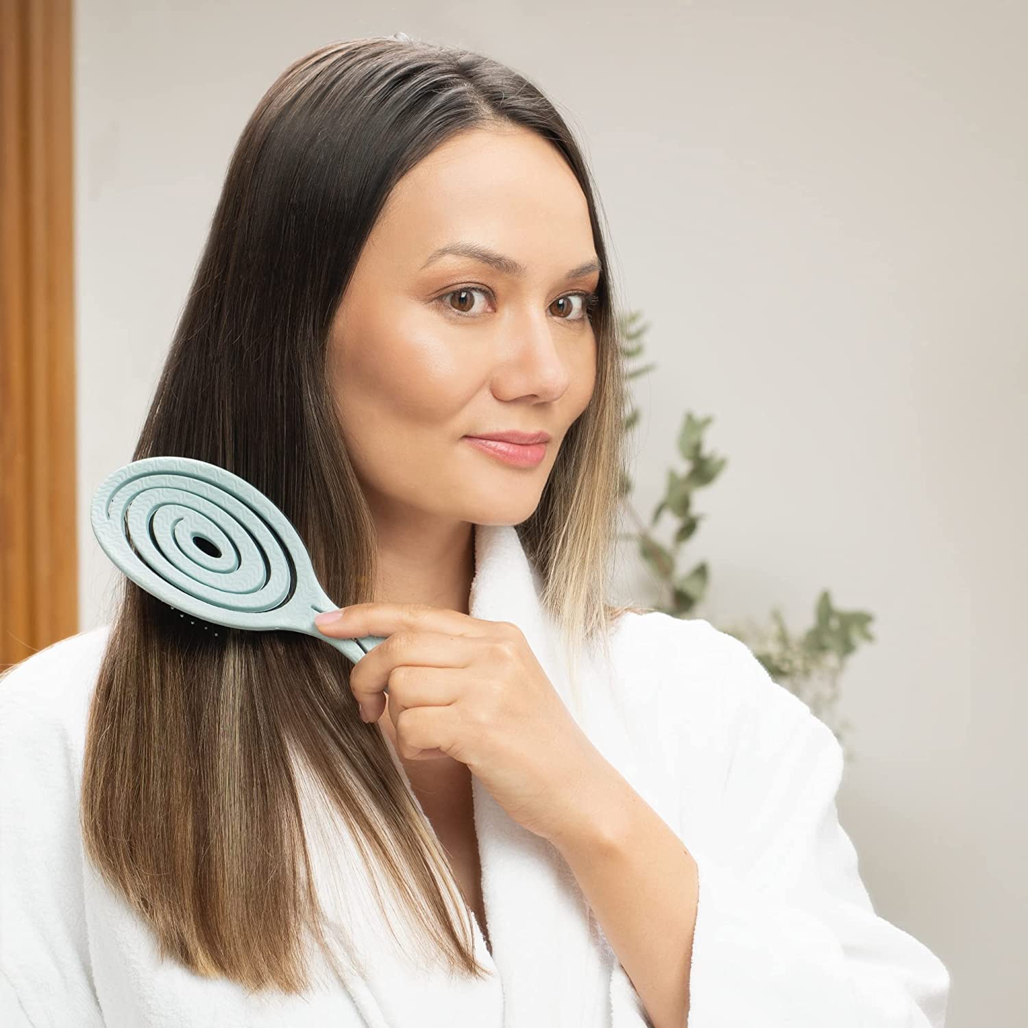 Ninabella detangle brush shown on curly, straight, and wavy hair textures