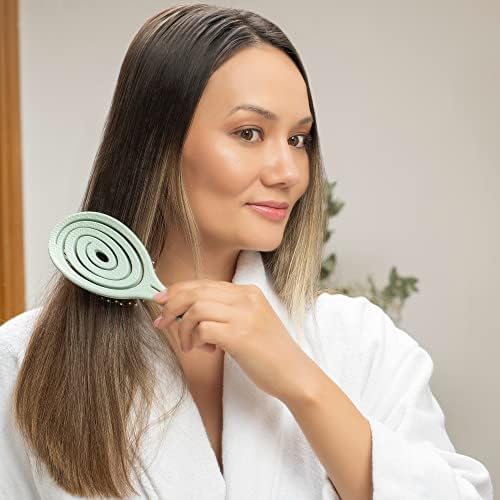 Ninabella detangle brush used on wigs and extensions to maintain condition