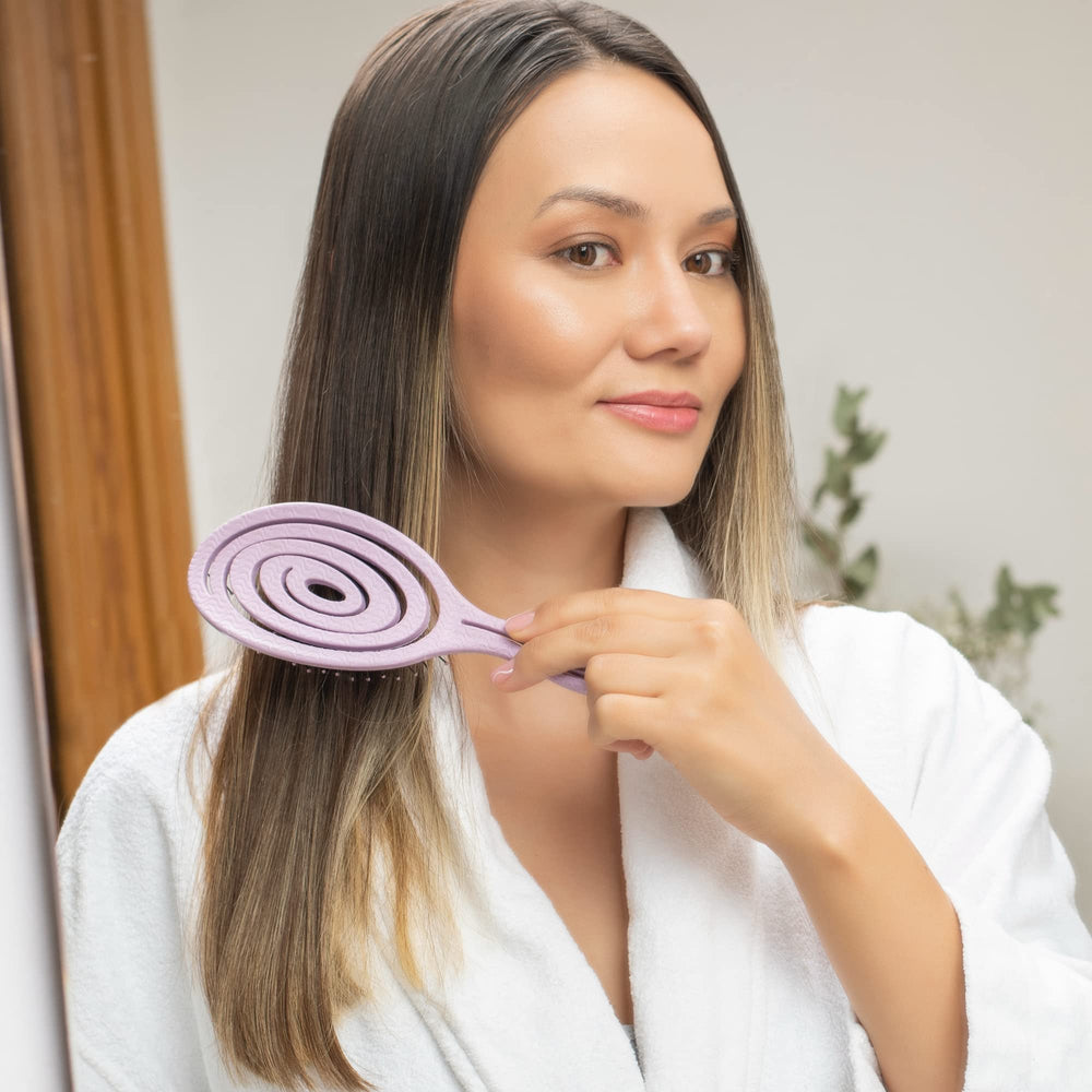 Ninabella detangle brush spiral design adapting to scalp shape.