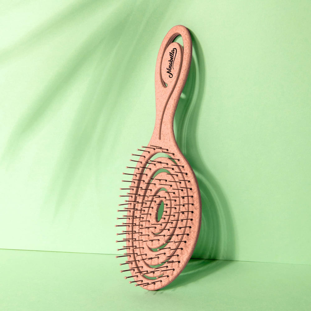Ninabella detangling brush helps protect hair from damage and split ends.