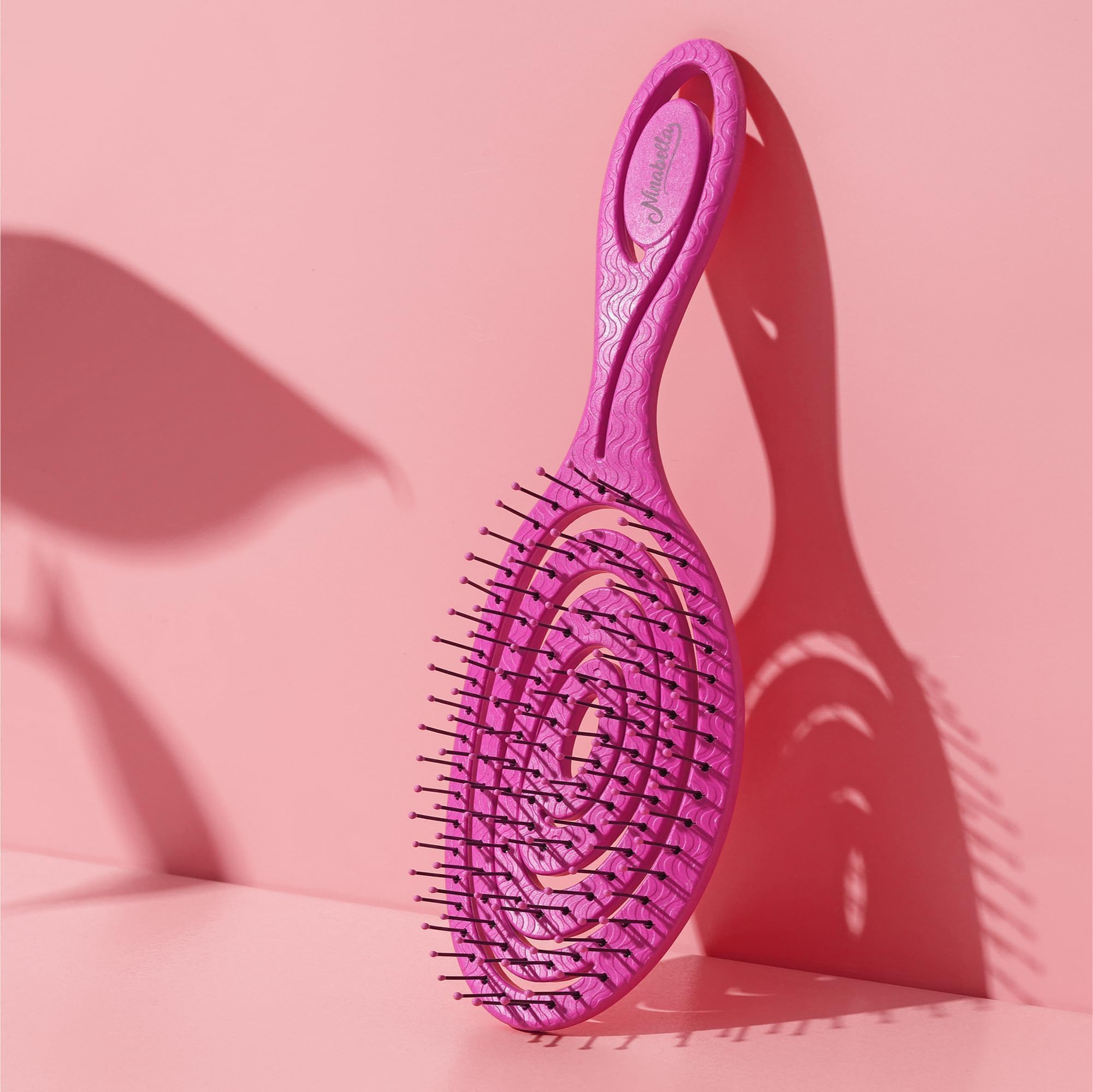 Ninabella Mini Spiral Brush works on wet hair detangling with gentle action.