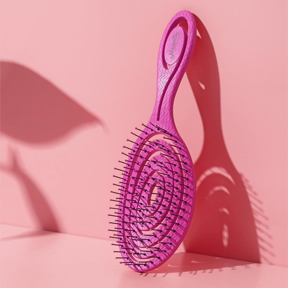 Ninabella Mini Spiral Brush works on wet hair detangling with gentle action.