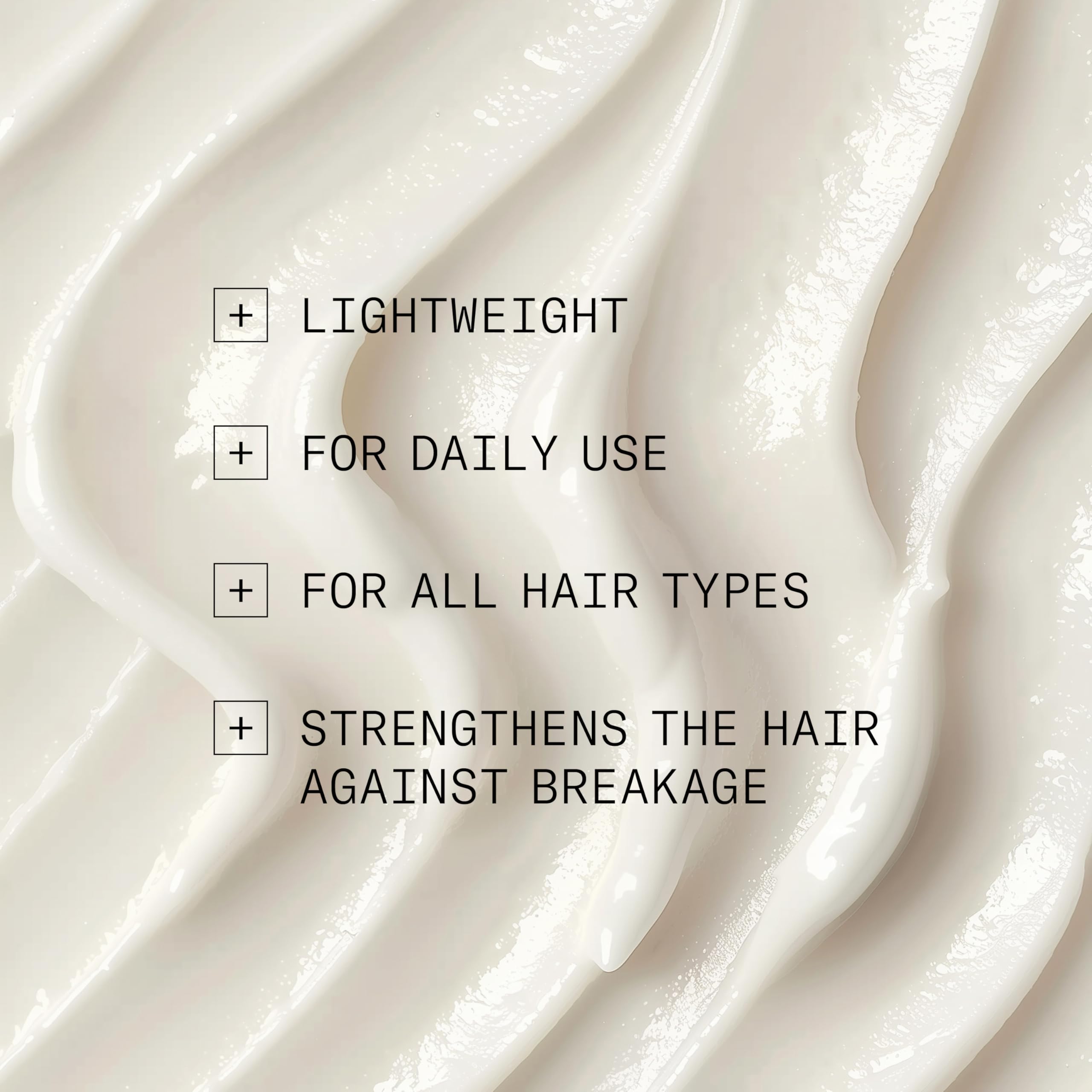 Close-up of NIOXIN Age Defense Conditioner on hair for manageability.