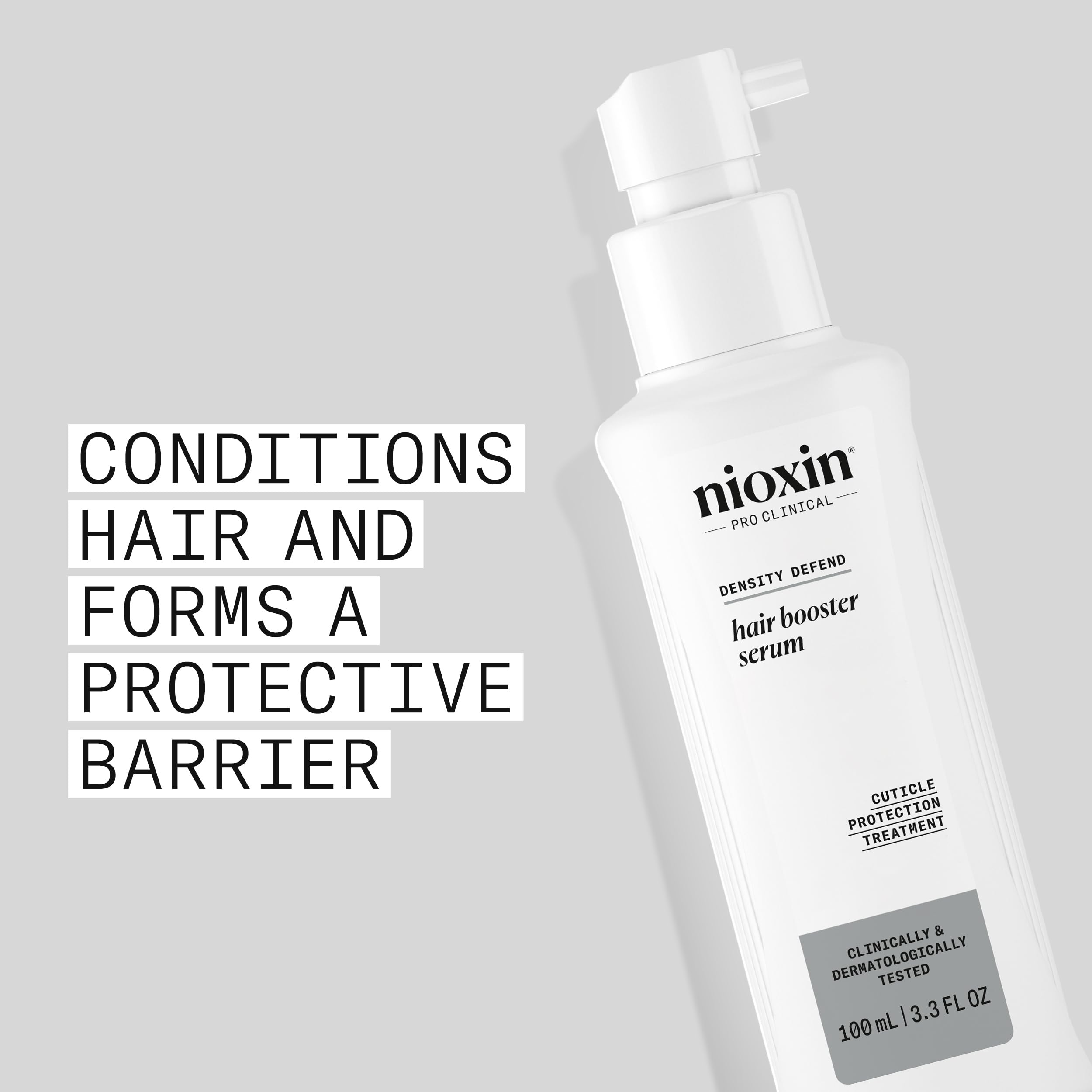 NIOXIN Hair Booster Serum bottle cap close-up for precise application.