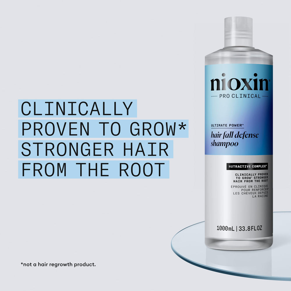 Nioxin Hair Fall Defense Shampoo application on scalp during massage.