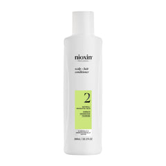 Nioxin System 2 conditioner bottle shows a lightweight formula for progressed thinning