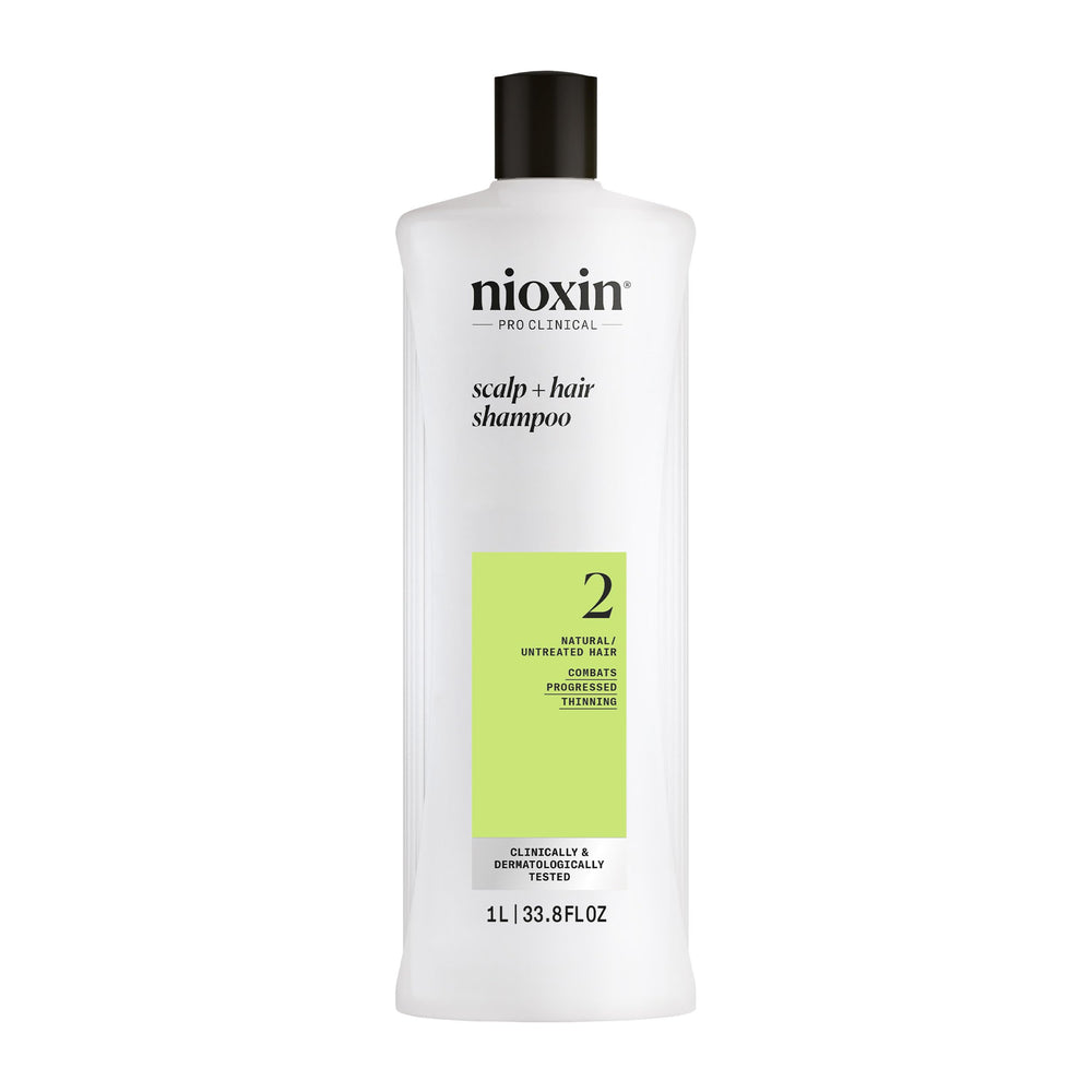 Nioxin System 2 Shampoo bottle on shelf suggesting scalp cleansing for progressed thinning