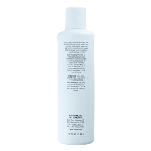 Nioxin System 4 conditioner in-use on scalp during routine.