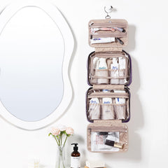 NISHEL purple toiletry bag hanging for easy access in hotel bathrooms.