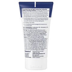 NIVEA MEN lotion on hand shows light texture and quick absorption.