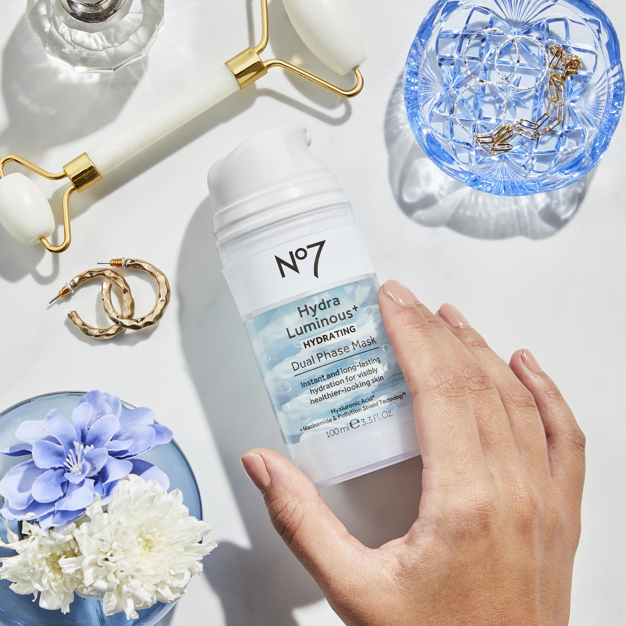 No7 HydraLuminous+ Pollution Shield graphic communicates protection against pollutants.