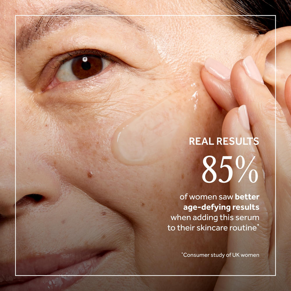 Applying No7 Restore & Renew serum to the face for firming and smoothing.