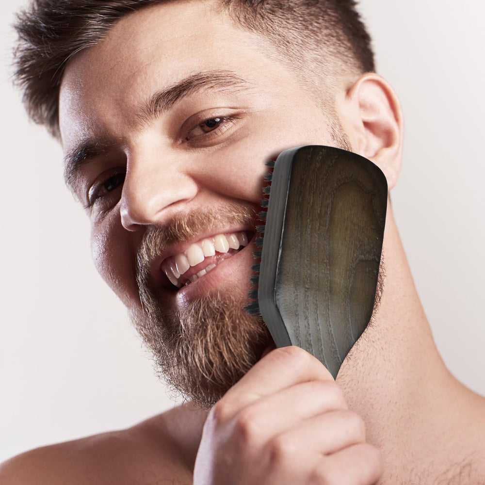 Norsewood Boar Bristle Brush ergonomic handle in use for daily grooming.