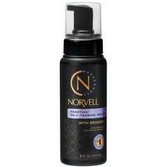 Norvell Venetian self-tanner mousse bottle on counter for quick at-home bronzing