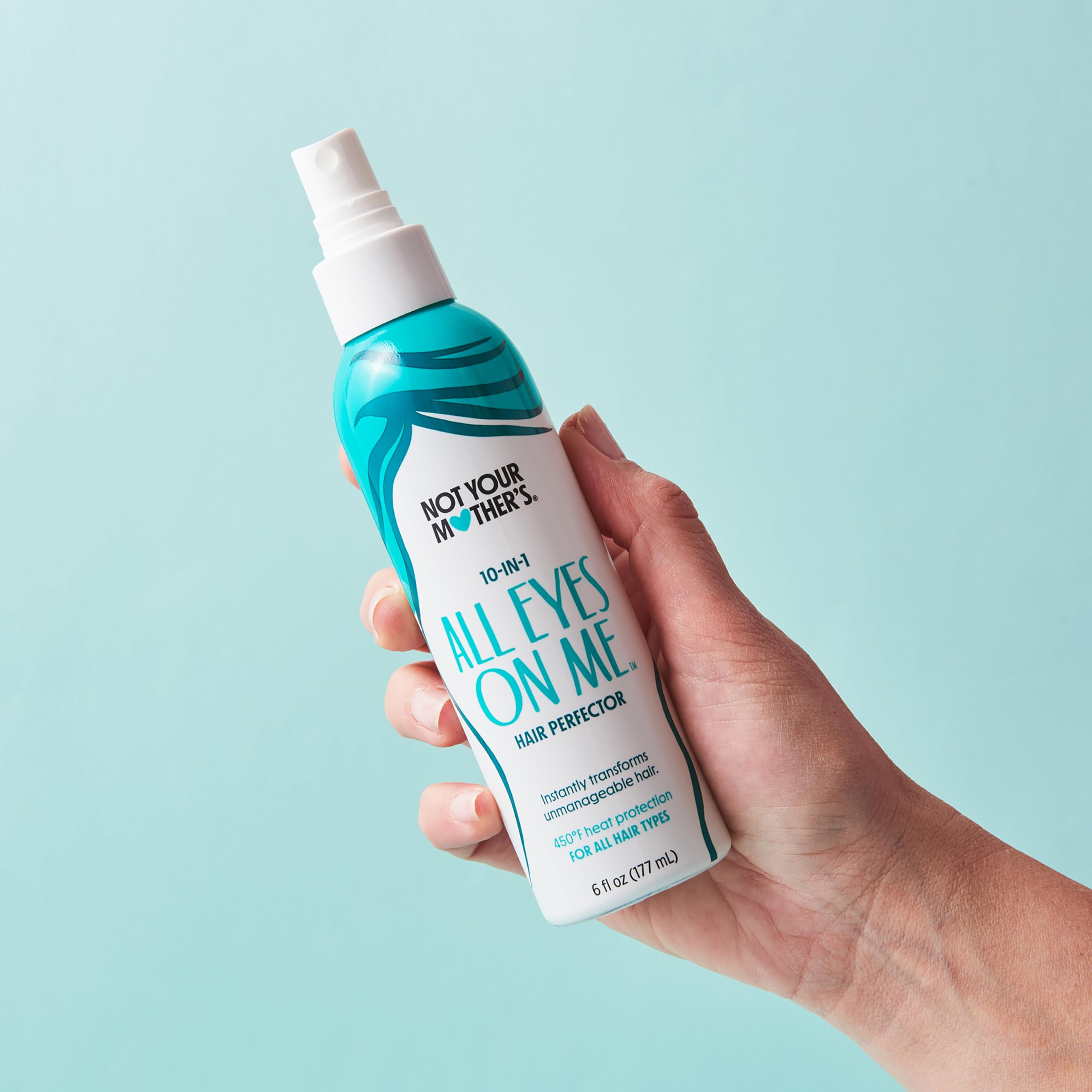 Not Your Mother's All Eyes On Me damp hair application shows mid-length to ends spray technique.