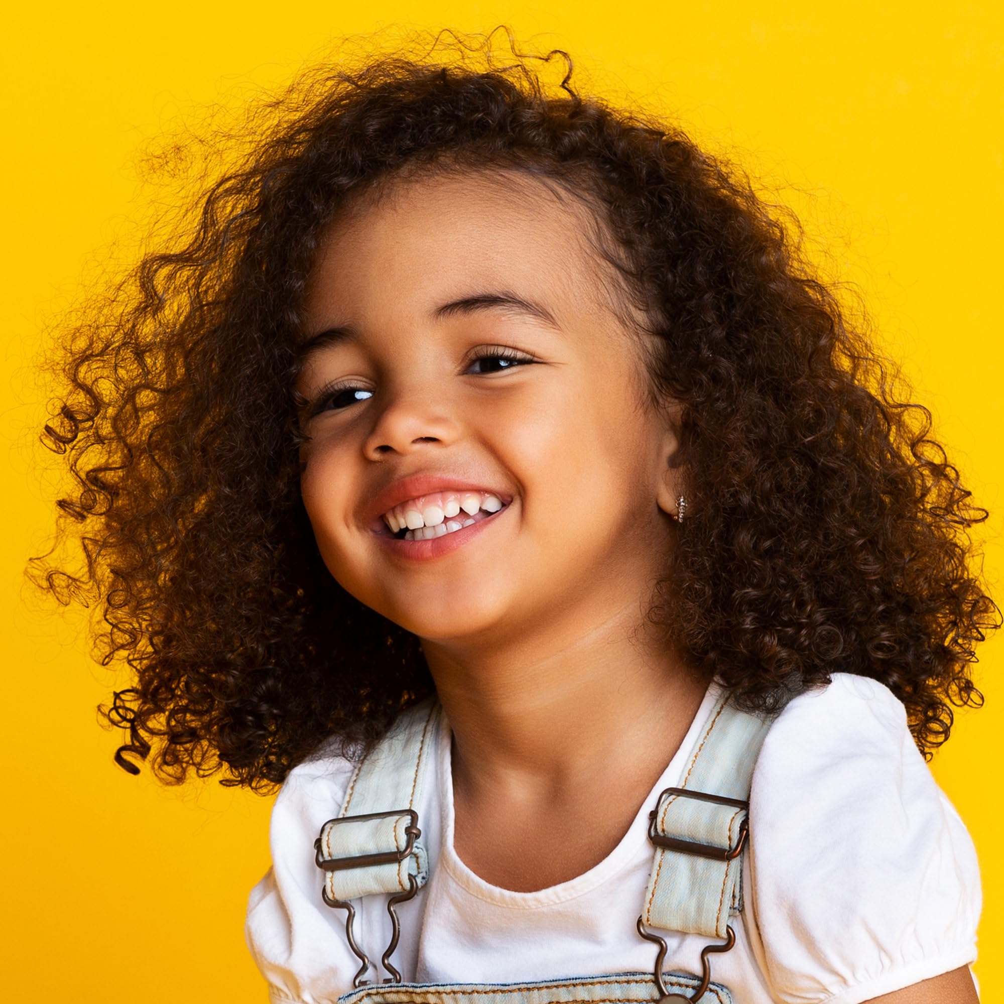 Not Your Mother's Kids Curly Care Detangler Spray eases detangling.