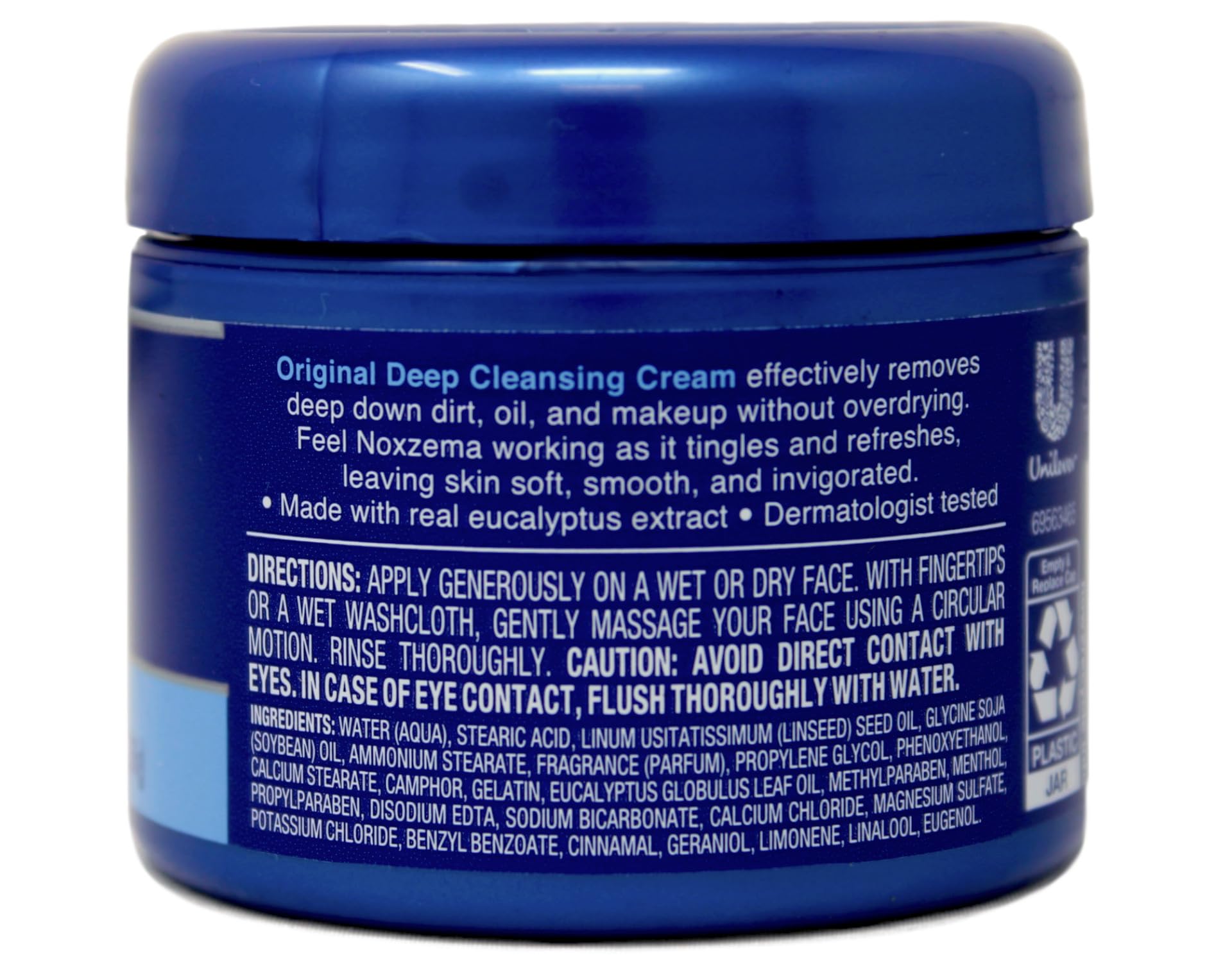 Close-up of Noxzema cream texture with a light eucalyptus tint.