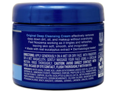 Close-up of Noxzema cream texture with a light eucalyptus tint.