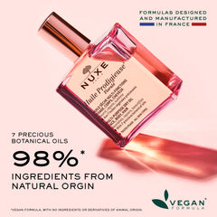 Hand application demonstrates easy massage for face and body with Nuxe oil.