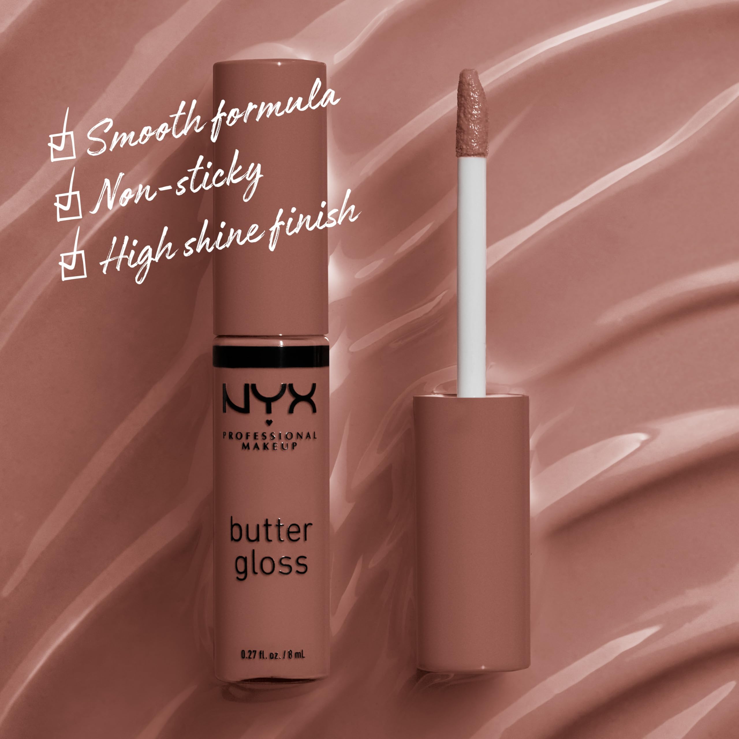 Closeup of NYX Butter Gloss Brown Sugar tube with creamy texture.