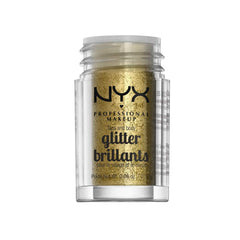 Close-up of NYX Face & Body Glitter Gold swirled on skin for shimmering depth.