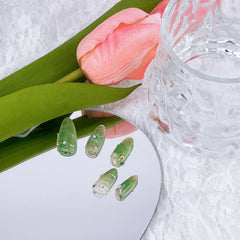 NZRAESTRS nails with silver star glitter for a subtle sparkle