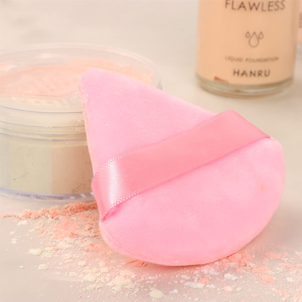 Ocim puff inside black and pink case for on-the-go makeup.