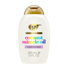 OGX Remedio de Daño con Aceite de Coco en botella, reparación suave.